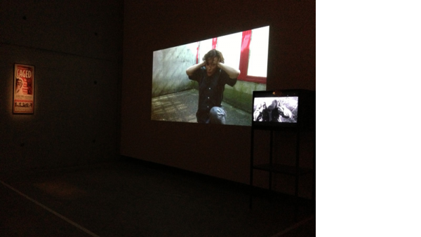 Prison Score, Liz Magic Laser, 2012, two-channel video and installation, 10 minutes, installation view, Contour 2013, Mechelen, Belgium.